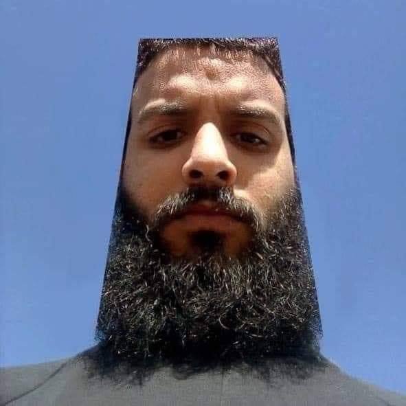 The meme features a screenshot of a person's face with a shocked expression, captioned "When you're about to die but you're still in the middle of a fight". The image is likely a photo of a person with a serious or angry face, with a bold font caption that emphasizes the absurdity of the situation. The meme is likely humorous because it exaggerates the idea of being in a life-or-death situation while still trying to maintain a sense of competitiveness or determination.